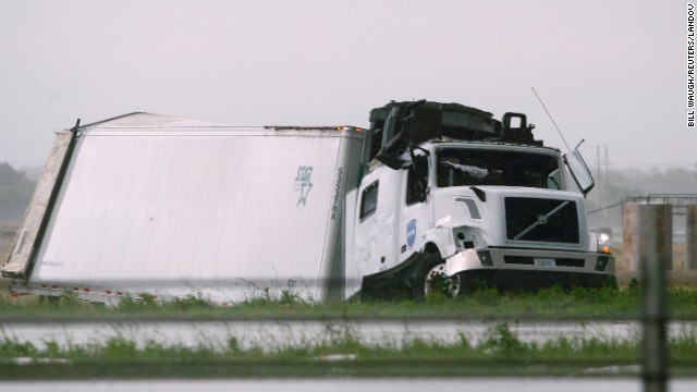 A semi tractor-trailer damaged by a tornado lies along I-40 just east of El Reno on May 31.