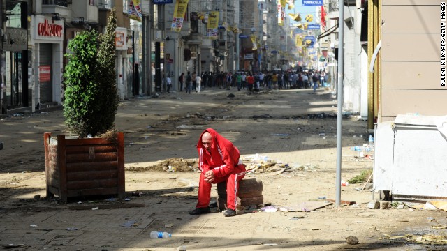 A man catches his breath behind the line where clashes are taking place on June 1.