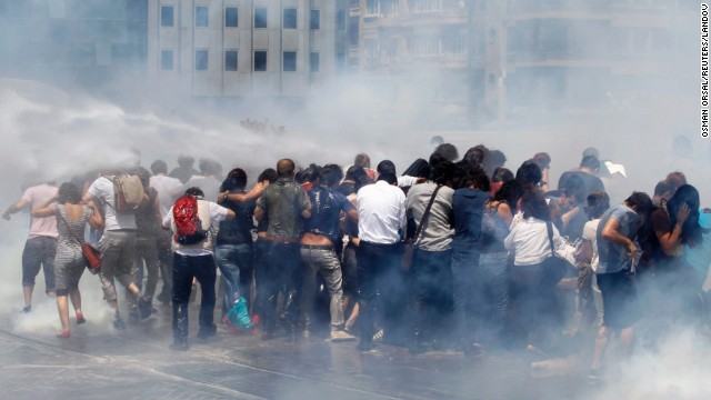 Riot police use tear gas and water cannons to disperse a crowd at Taksim Square on May 31.