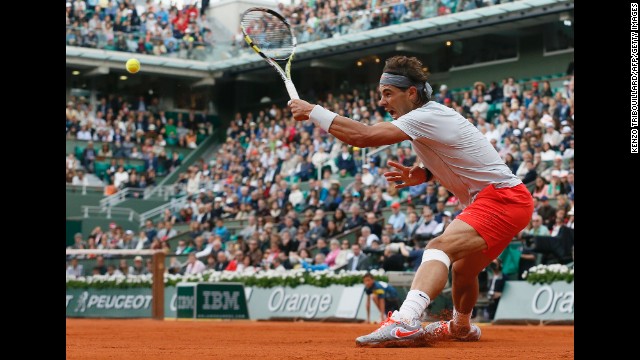 Spain's Rafael Nadal returns to Italy's Fabio Fognini on June 1. Nadal took the match 7-6(5), 6-4, 6-4.