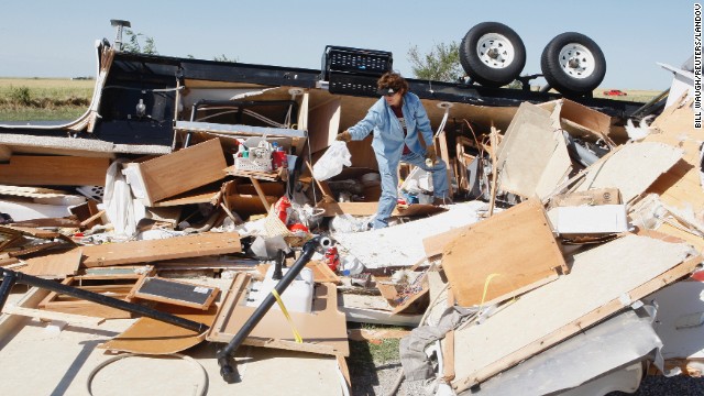 Mikie Hooper collects her belongings from her RV, which was destroyed by a tornado in El Reno, Oklahoma, on June 1.