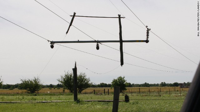 The tornado severed the pole supporting these power lines, leaving the remnants dangling near El Reno on June 1.