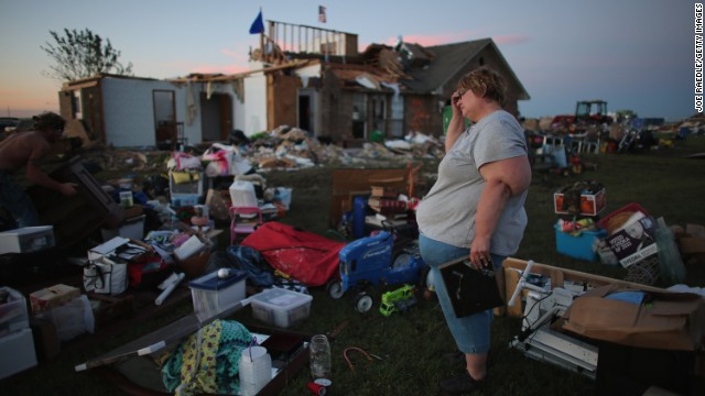 Yvonne Merritt stands among the things she was able to save from her home in El Reno on June 1.