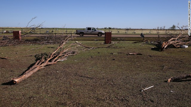 Downed trees sit in the parking lot of the Canadian Valley Technology Center in El Reno on June 1.