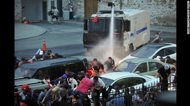 Police use a water cannon to disperse protesters outside Turkish Prime Minister Recep Tayyip Erdogan's working office in Istanbul on June 2.