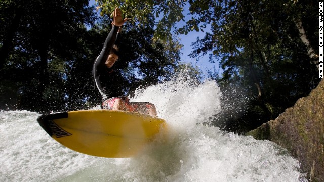 The Qiantang River is just one of a growing number of inner-city surfing spots around the world. Munich's Eisbach River (pictured) has been a popular surfing destination for more than four decades. 