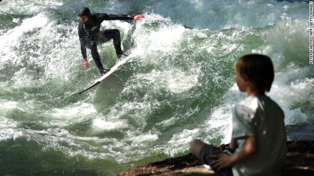 The German river is nestled in the heart of Munich's English Gardens, attracting surfers late into the night and a steady stream of onlookers. 