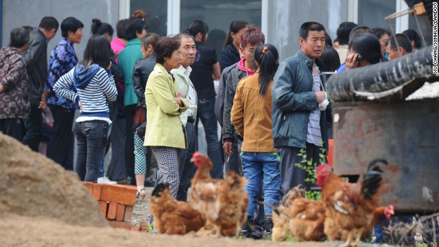 Family members of missing workers wait for information.