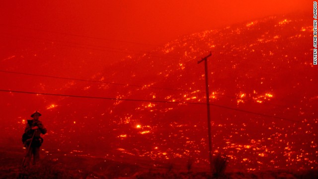 Firefighters battle the Powerhouse wildfire at the Angeles National Forest on June 1.