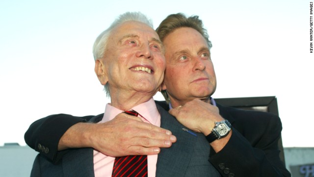 At the premiere of "It Runs In The Family," in April 2003, Douglas and his father, actor Kirk Douglas, left, embrace at the Bruin Theater in Los Angeles.