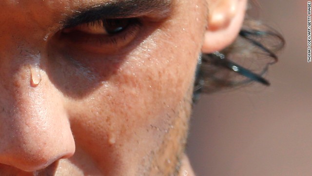 Sweat runs down the face of Spain's Rafael Nadal during his match against Japan's Kei Nishikori at the French Open on Monday, June 3, in Paris.