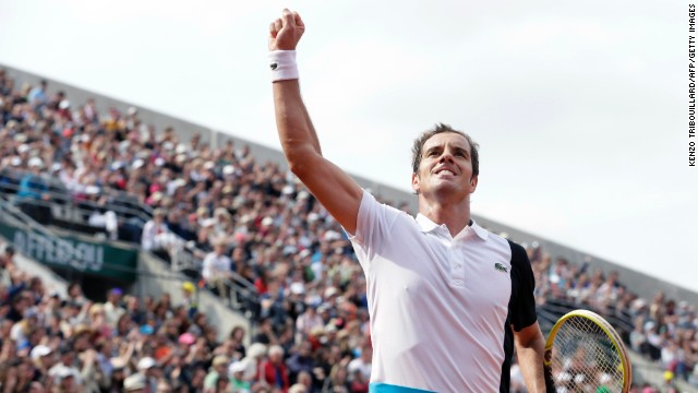 After winning a second set against Switzerland's Stanislas Wawrinka, France's Richard Gasquet celebrates at the French Open on June 3. 