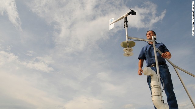 Tim Samaras, 54, stands with an anemometer, a device used to measure wind speed. The May 31 tornado had winds of at least 136 mph, according to a preliminary National Weather Service rating.