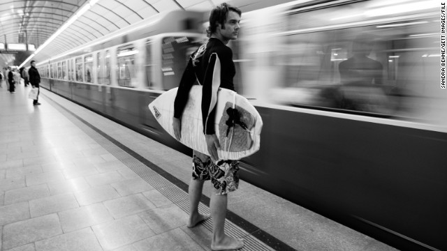 Here, surfer Alex Foerderer waits for a train to Eisbach. It was illegal to surf the icy brook until 2010, when the city of Munich allowed experienced surfers to ride the one-meter waves. 