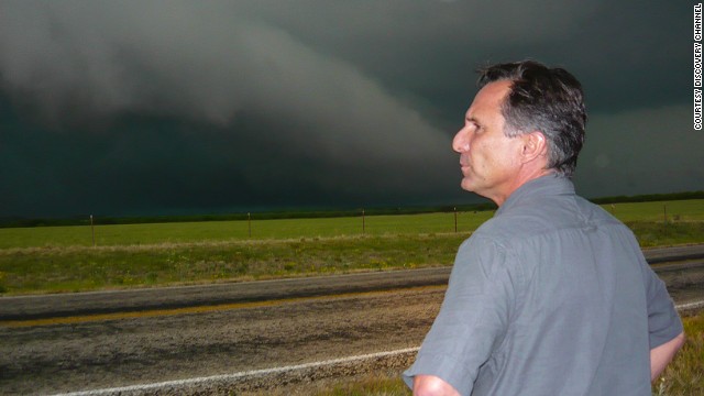 Tim Samaras looks out at storm clouds. The Weather Channel described him as a self-taught forecaster and engineer who developed much of the equipment he used to measure storms.