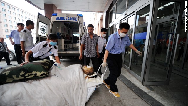 An injured worker is wheeled into a hospital in Changchun.