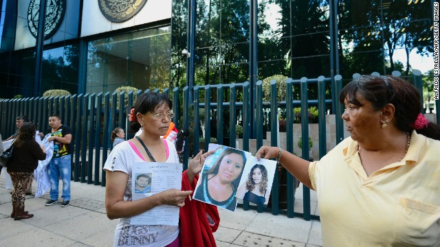 Relatives of the 11 missing youth protest in front of the general attorney's office in Mexico City on May 31.