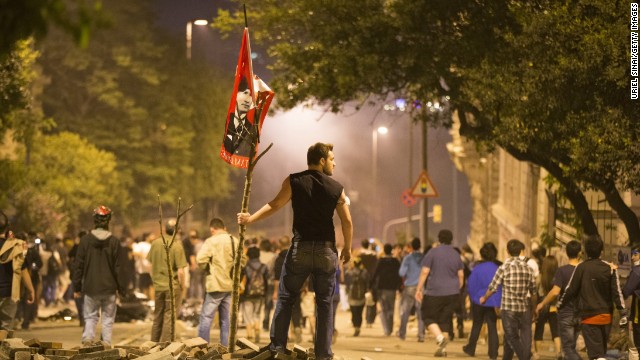 A protester looks on during clashes with Turkish police outside of Prime Minister Recep Tayyip Erdogan's office, near Taksim Square in Istanbul on Tuesday, June 4. 