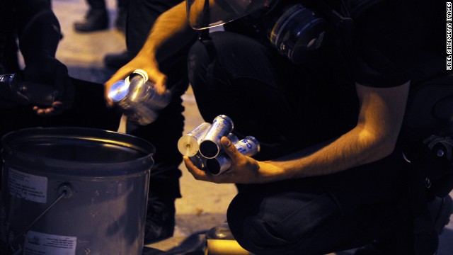 Riot policemen unload tear gas during clashes in Istanbul on June 3.