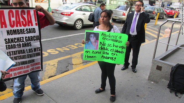 What happened to 11 young people who were forced at gunpoint into a van in Mexico City's popular Zona Rosa entertainment district on May 26? <a href='http://www.cnn.com/2013/06/04/world/americas/mexico-missing-mystery/index.html?iref=allsearch'>The mystery has gripped nation</a>. Penelope Ramirez is a cousin of Jerzy Ortiz Ponce, who is one of the 11 missing people. She holds a sign with his picture during a gathering of family members in the Tepito area of Mexico City on May 31.