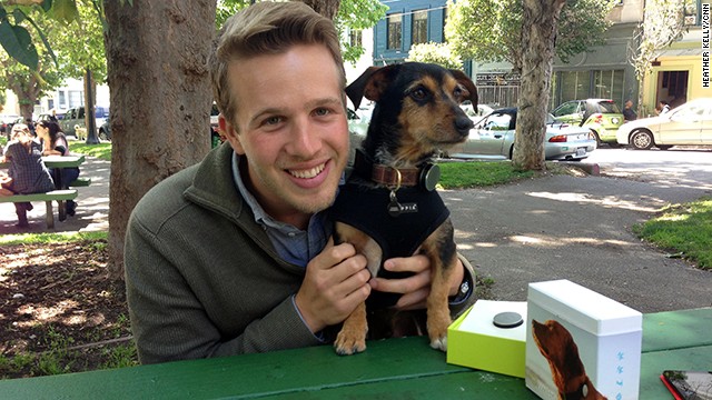 Whistle co-founder and CEO Ben Jacobs and beta tester Duke, who is modeling the company's new pet activity tracker. 