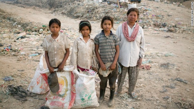 Sreyna stands next to her mother and two other girls. The Smiths made a deal with the girls' mother to pay her what her daughters would make at the dump in exchange for sending the girls to school. 