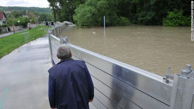 A man walks near a flood protection wall in Bratislavas, Slovakia, on June 5.