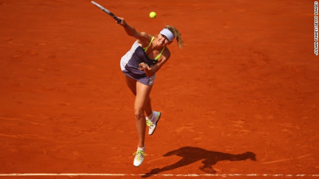 Maria Sharapova of Russia serves to Victoria Azarenka of Belarus during their semifinal match of the French Open at Roland Garros in Paris, on June 6. 