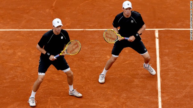 Brothers Mike, left, and Bob Bryan of the United States wait for a return from Alexander Peya of Austria and Bruno Soares of Brazil on June 6.