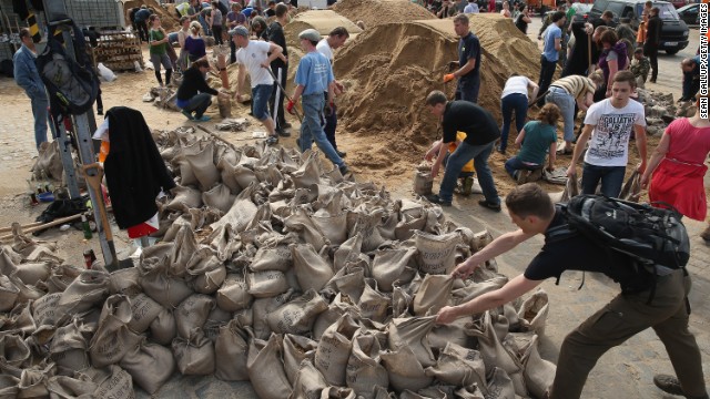 Volunteers fill sandbags to protect Dresden, Germany, from rising floodwaters of the Elbe River on June 6.