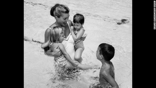 Williams plays with her three children, Susan, Kimball and Ben, circa 1955.