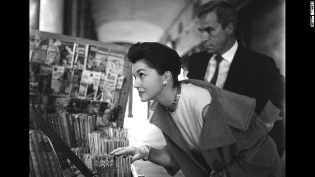 Williams and Argentine actor Fernando Lamas, whom she would later marry, walk through the Plaza Mayor in Madrid in 1961.