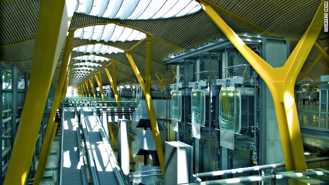 Light comes through large skylights into the circulation systems at Madrid-Barajas Airport's check-in and departures area. 