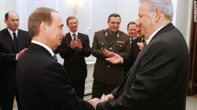 Russian President Boris Yeltsin, right, shakes hands with Putin during a farewell ceremony at the Kremlin in Moscow on December 31, 1999. Putin rose quickly through the political ranks, becoming the second democratically elected president of the Russian Federation in 2000.