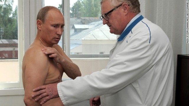 Putin receives a medical consultation during his visit to the Smolensk Regional Hospital on August 25, 2011. Putin said he hurt his shoulder during morning judo practice.