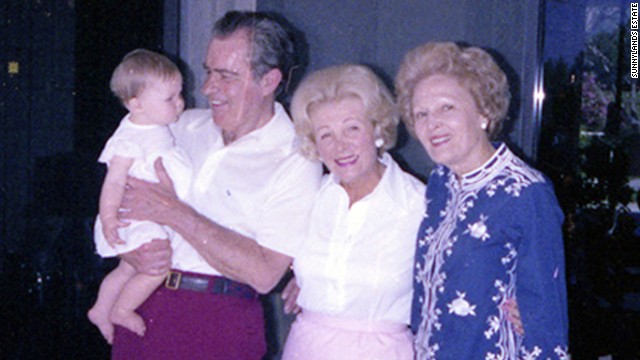 Former President Richard Nixon holds his granddaughter Jennie outside the Game Room in 1979. He's with Leonore Annenberg and wife Pat Nixon, right.