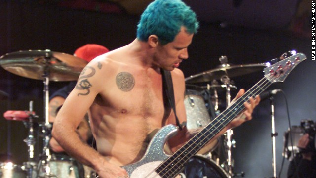 Red Hot Chili Peppers bassist Flea, whose real name is Michael Balzary, performs nude at Woodstock '99, a summer musical held in Rome, New York, as a tribute to its 1969 namesake.