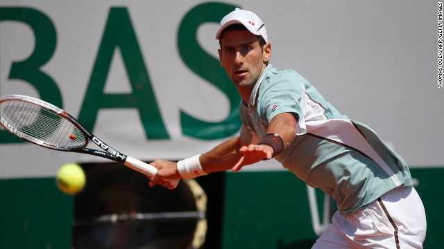 Djokovic returns a shot to Nadal on June 7.