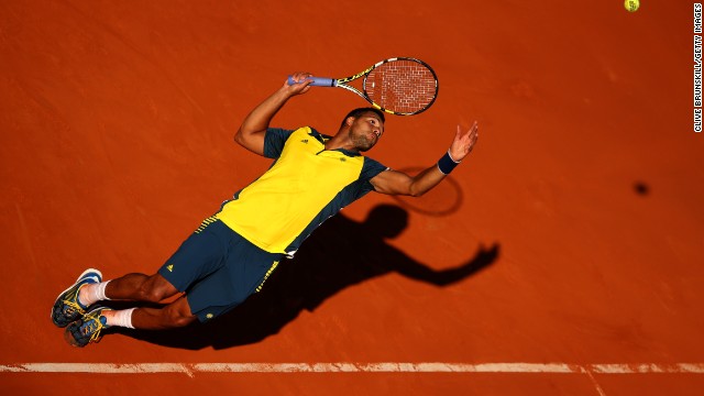 Tsonga reaches to hit a return to Ferrer on June 7.