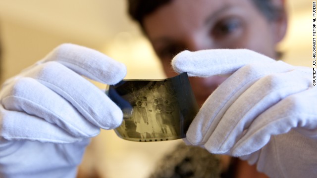 Film archivist Lindsay Zarwell examines original negatives donated by George Timothy Gross in Los Angeles.