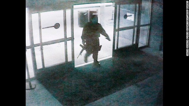 This photo, released by the Santa Monica Police department, shows the gunman entering the Santa Monica College library on June 7. The gunman's shooting spree began in a home near the college, where two were found dead, and ended when police killed him in the college library. Santa Monica police have identified the suspect as John Zawahri. 