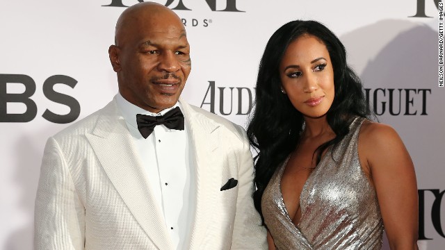 Mike Tyson, star of "Undisputed Truth" on Broadway, arrives with Lakiha Spicer.