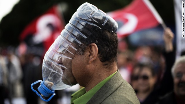 A demonstrator covers his face with a makeshift gas mask during protests in Kizilay Square in Ankara on June 9. 