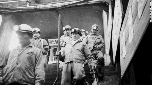 Miners descend down a mine shaft on Hashima -- the last pit closed in 1974.