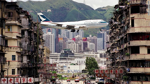 Iconic scene from Kai Tak International Airport -- a Cathay Pacific jet between apartment buildings in Kowloon City. 