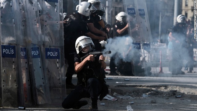 Riot police fire tear gas at demonstrators in Taksim Square on June 11.