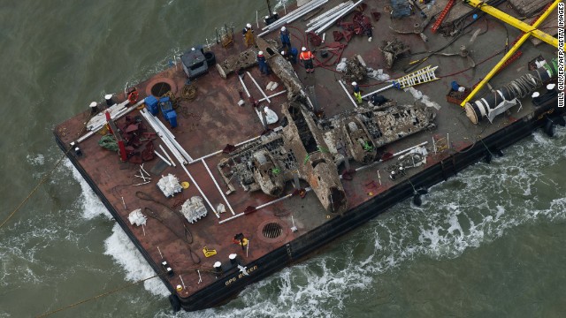 The wreck of the German World War II Dornier Do-17 plane is transported on a barge to a harbor near Ramsgate, England, on Tuesday, June 11. The bomber was shot down during the Battle of Britain in 1940.