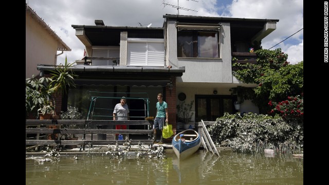 People salvage items from their house, which was flooded by the Danube River, in Dunakeszi, Hungary, on June 12.