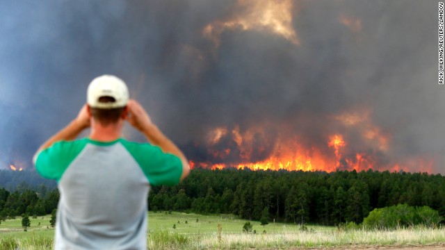 Schad Dohl watches a wall of fire as it rages through the Black Forest near Colorado Springs on Wednesday, June 12.