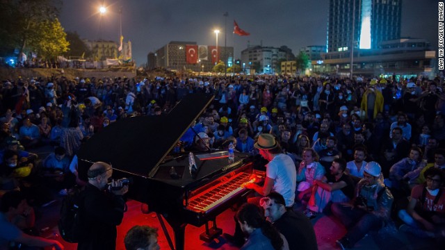 Protesters listen to a piano performance at Taksim Square on Tuesday in Istanbul, Turkey. 